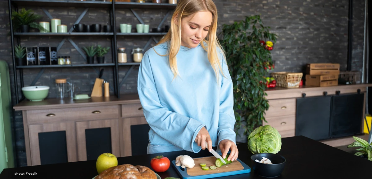Talking About Your Daily Routine in English for Beginners 5, a woman preparing and cooking her dinner