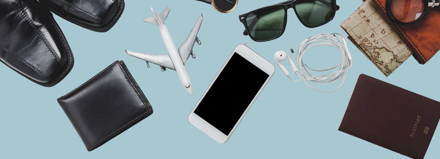 Essential English Phrases for Airport Conversations A Guide for a Smooth Trip, image of travelling essentials like passport, wallet, sunglasses, mobile phone